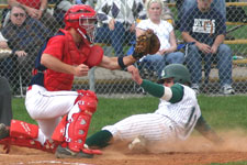 Bryce Ayoso slides home safely on the close play at the plate