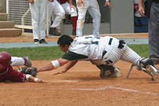 Bryce Ayoso attempts to tag avoiding baserunner at the plate