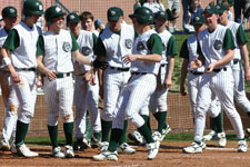 Team congratulating Austin Rowberry after a home run