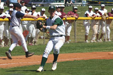 Brian Chatterton fields the bunt and throws to first