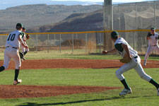 Brian Chatterton throws to first base fielding the slow grounder