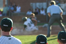 Provo Bulldogs watch play at the plate