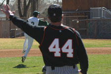 Andrew Law fields the slow roller and throws it to first