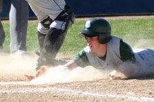 Alex Larsen slides head first safe into home