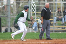 Andrew Law steps on home plate