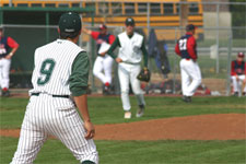 Brian Chatterton throws to first baseman Clint Phillips for the out