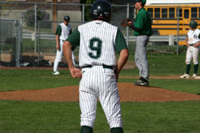 Clint Phillips stands on first base after getting beaned