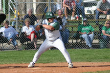 Curtis watches a pitch go over his head