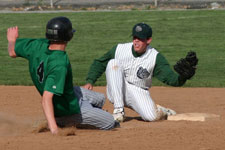 Andrew Law tags the runner at second base