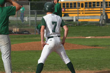 Alex Larson stands on first base