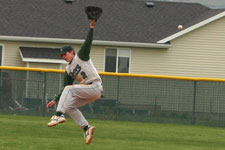 Andrew Law dives at ball over the infield