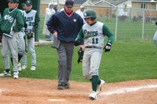 Bryce Ayoso touches home plate