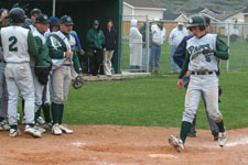 Austin Rowberry touches home plate