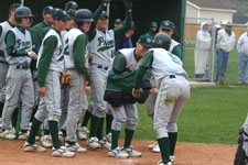 Team greets Austin Rowberry at the plate