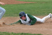 Andrew Law dives safely back to first base on the pickoff attempt