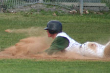 Andrew Law slides safely into third base, getting two bases on a passed ball