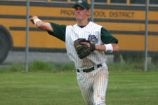 Brian Chatterton throws to first base