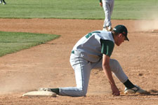 Pitcher Craig Brimhall doesn't recieve the ball in time for the out