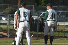 Coach Moore talks to pitcher Bryce Ayoso