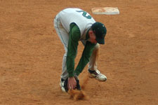 Andrew Law fields a ground ball out of the dirt