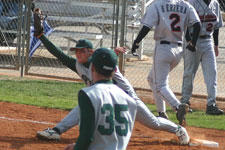 Curtis Porter stretches at first base to complete the double play