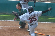 Bryce Ayoso awaits the throw on a play at the dish