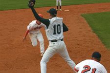 Brian Chatterton grabs throw to tag out runner diving for third