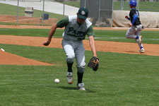 Chris Wright picks up a slow roller up the infield