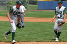 Chris Wright steps on the first base bag for the out