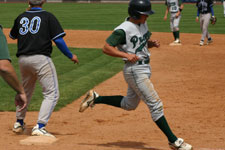 Clint Phillips reaches first base