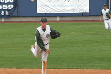 Andrew Law throws to first base