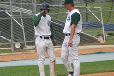 Andrew Law and Coach Moore talk things over