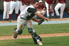 Bryce Ayoso fields the bunt and throws to first