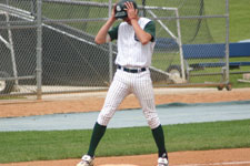 Dustin Migliaccio stands on third base