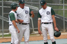 Coach Moore with baserunners Drew Hortman and Dustin Migliaccio