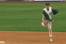 Andrew Law throws to first base