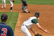 Dustin Migliaccio digging out ball covering first base