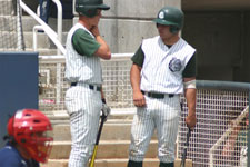 Austin Rowberry and Bryce Ayoso converse while waiting to bat