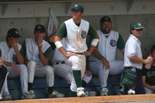 Ben Hatch stands in front of the Bulldog dugout