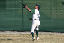 Austin charges the outfield ball