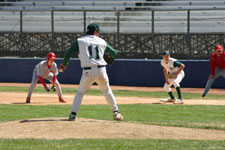 Travis pitching with a man on