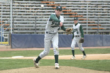 Craig Brimhall holds the runner at first