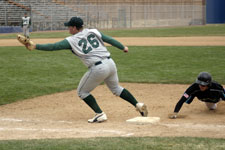 Dave Griner holds the runner on first