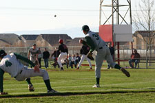 Blake throws to first after fielding