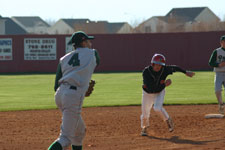 Runner looks to advance as Craig throws to first